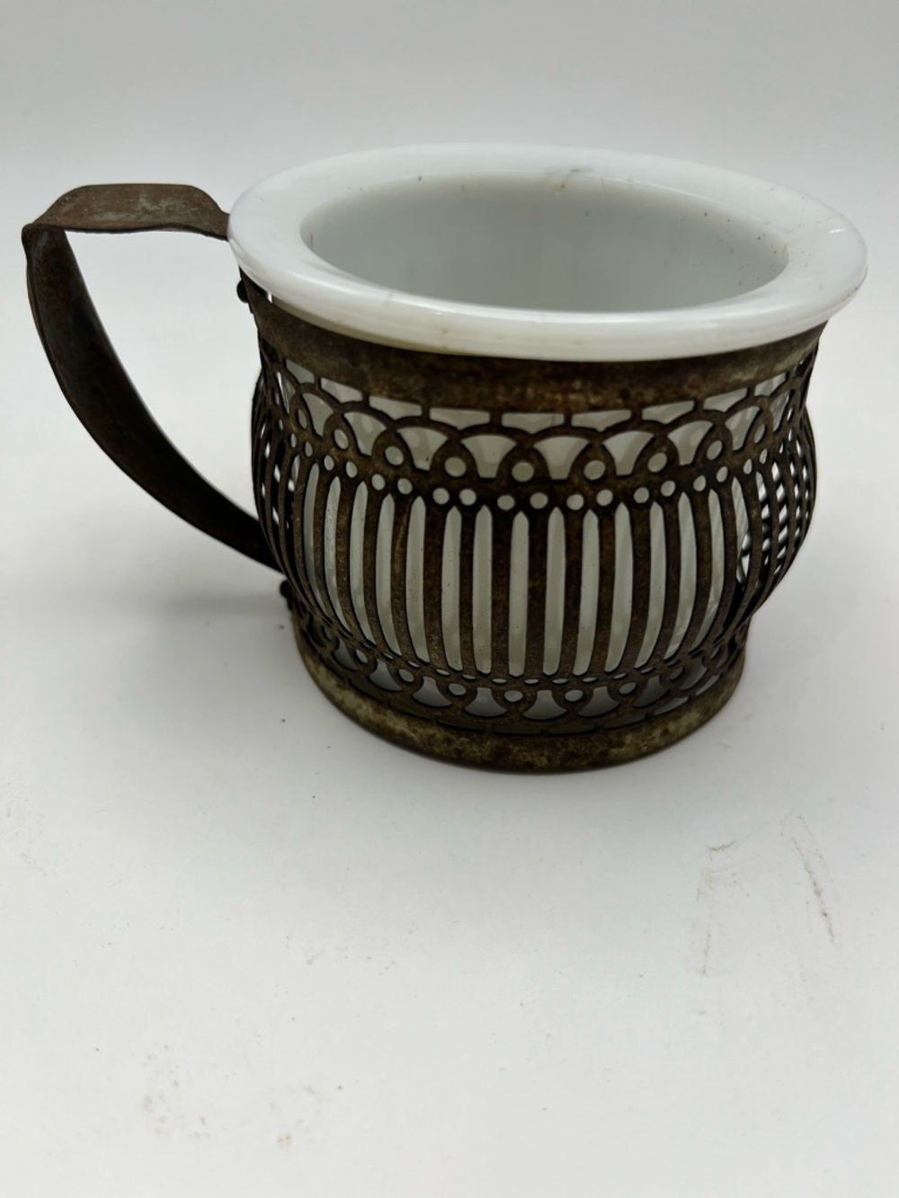 Antique White Glass Mug with Ornate Metal Holder